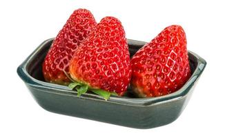 Strawberry in a bowl on white background photo