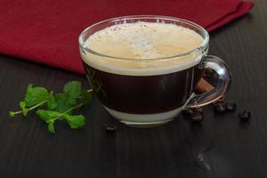 Coffee on wooden background photo