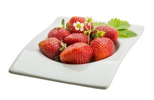 Ripe strawberry in a bowl on white background photo