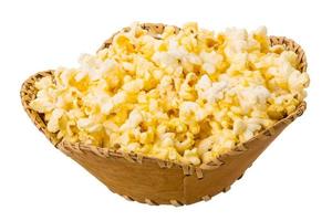 Popcorn in a basket on white background photo