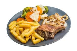 T-bone steak on the plate and white background photo