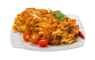 Italian Lasagna on the plate and white background photo