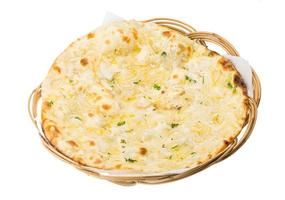 Onion naan on wooden plate and white background photo