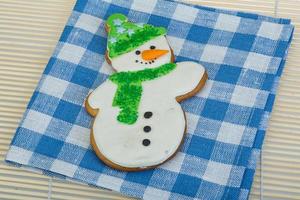 Christmas gingerbread on wooden background photo