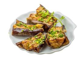 Grilled eggplant on the plate and white background photo