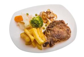 T-bone steak on the plate and white background photo