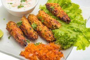 Shish kebab on the plate and white background photo
