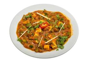 Kadai Paneer on the plate and white background photo