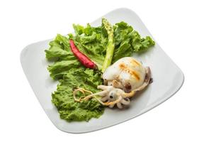 Grilled cuttlefish on the plate and white background photo