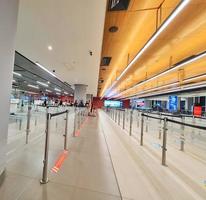 Istanbul, Turkey on July 2022. Several tourists are queuing for passport checking at the passport control counter, both local and international tourists. photo