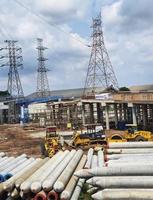 West Java, Indonesia on July 2022. Pile of concrete spun pile in a stockyard. photo
