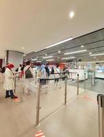 Istanbul, Turkey on July 2022. Several tourists are queuing for passport checking at the passport control counter, both local and international tourists. photo