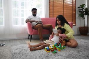 Joyful multiethnic family and their leisure at home photo