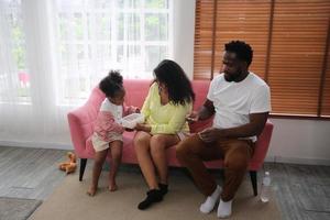 Joyful multiethnic family and their leisure at home photo