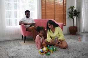 Joyful multiethnic family and their leisure at home photo