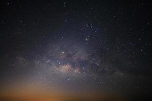 Milky way galaxy with stars and space dust in the universe, Long exposure photograph, with grain. photo