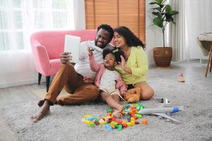 Happy african family having playful time at home,  Family love, Parents and toddler indoor photo