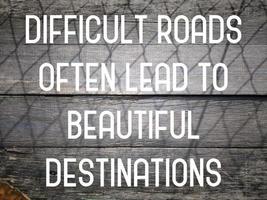 Difficult roads often lead to beautiful destinations. Inspirational quote for success life. photo