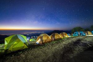 Starry night sky with tent at Monson viewpoint Doi AngKhang and milky way galaxy with stars and space dust in the universe photo