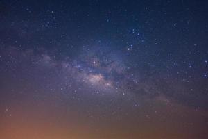 The milky way galaxy with stars and space dust in the universe, Long exposure photograph, with grain photo