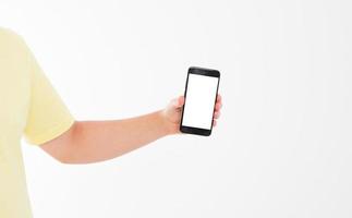 Hand holding black phone isolated on white clipping path inside. Top view.Mock up.Copy space.Template.Blank. photo