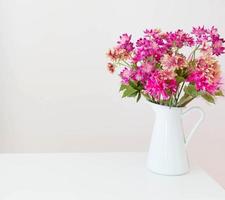 flowers in white vase photo