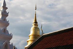 golden pagoda in Thailand photo