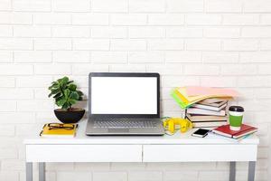 Workspace with computer and notebook. Copy space and top view. Selective focus photo