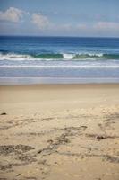 Waves crashing on a beach photo