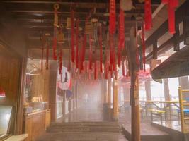 zhangjiajie.China - 14 October 2018.Red ribbon hang on the ceiling in tianzi mountain Zhangjiajie National Forest Park in Wulingyuan District Zhangjiajie City China in the Foggy day. photo