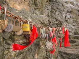 zhangjiajie.China - 15 october 2018.Close up Lock key locking on the chain on heaven gate tianmen mountain national park at Zhangjiajie city china. photo