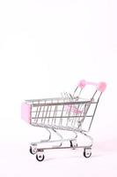 Metalic supermarket car, pink, isolate photo