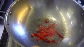 Peppers and onions sauted in a wok video