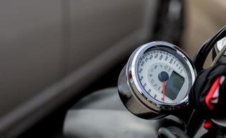chromed motorcycle speedometer.