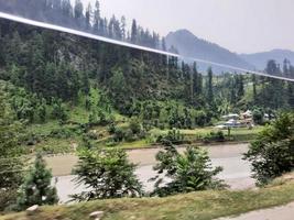 Kashmir is the most beautiful region in the world which is famous for its green valleys, beautiful trees, high mountains and flowing springs. photo