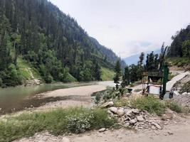 Kashmir is the most beautiful region in the world which is famous for its green valleys, beautiful trees, high mountains and flowing springs. photo