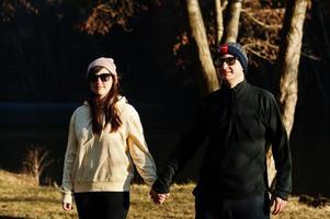 Couple in pound at early spring park. photo