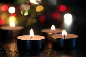 Candle light and bokeh background in the darkness with space for text or image. photo