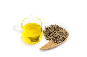 Hemp oil in a glass jar isolated on a white background, Pure cold pressed oils concept, CBD hemp oil. photo