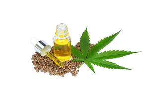 CBD cannabis oil. Hemp oil capsules and  hemp seed isolated on white background. medical marijuana concept. photo