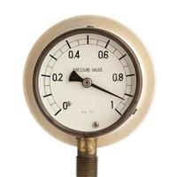 High pressure concept. Industrial pressure gauge manometer marking high readings isolated on white background photo