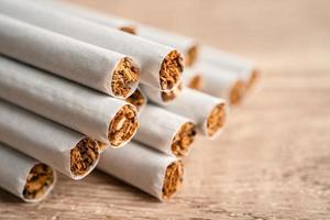 Cigarette, tobacco in roll paper with filter tube, No smoking concept. photo