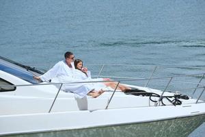 young couple on yacht photo