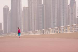 woman running on the promenade photo