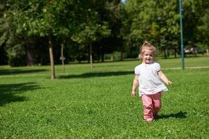 little girl have fun in park photo