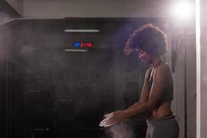 black woman preparing for climbing workout photo