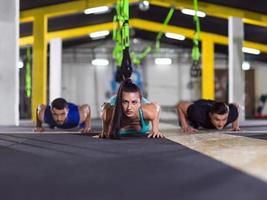 young healthy people doing pushups photo