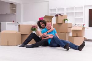 young  gay couple moving  in new house photo