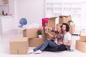 young couple moving  in new house photo
