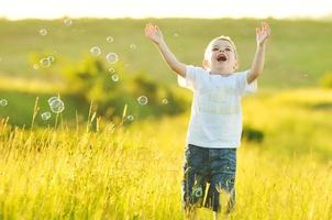 child bubbles outside photo